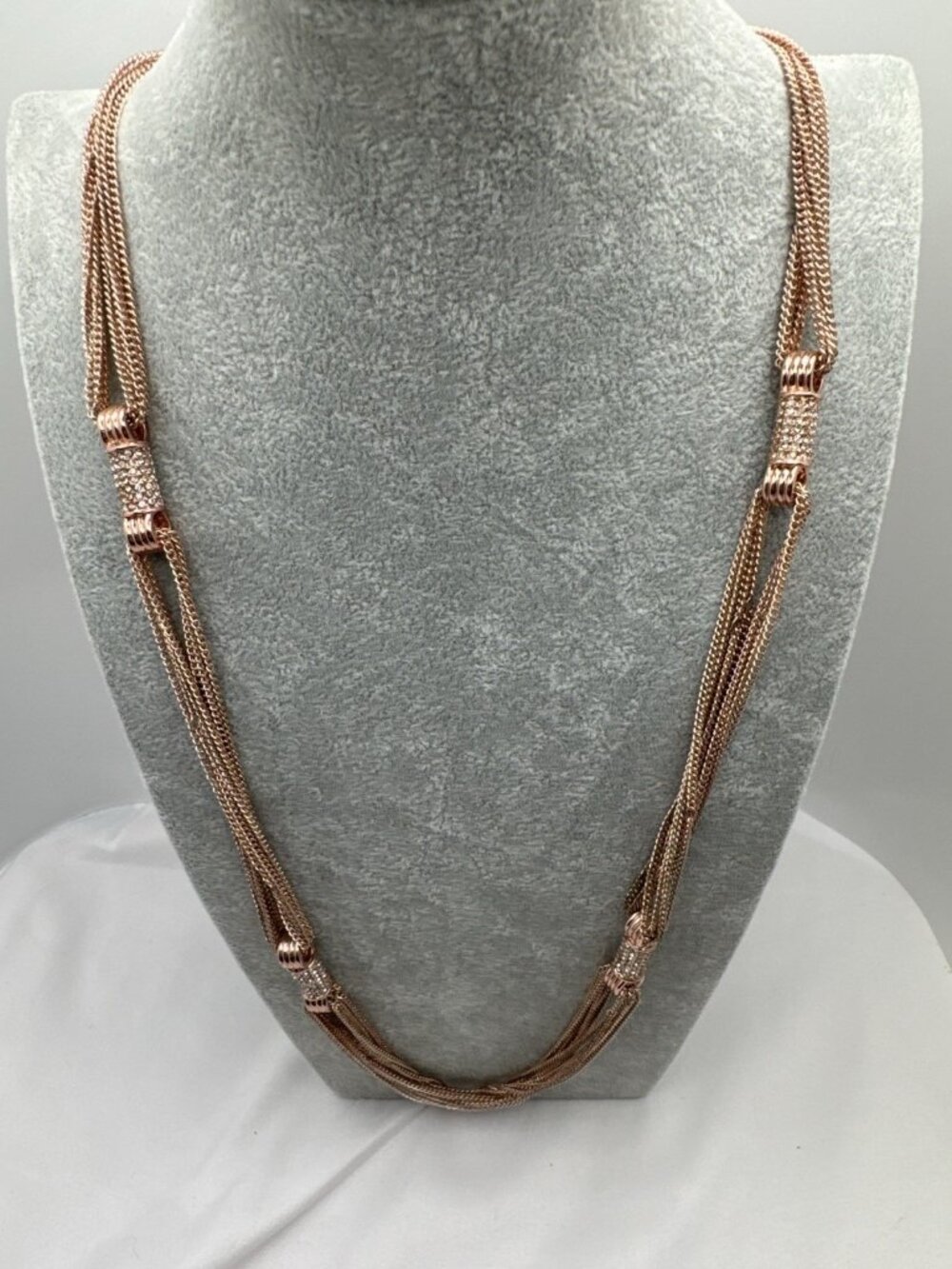 Nicole Miller Elegant Multi-Strand Rose Gold Necklace with Crystal Accents 38"